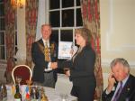 RIBI President David Fowler giving a banner to President Kim.
